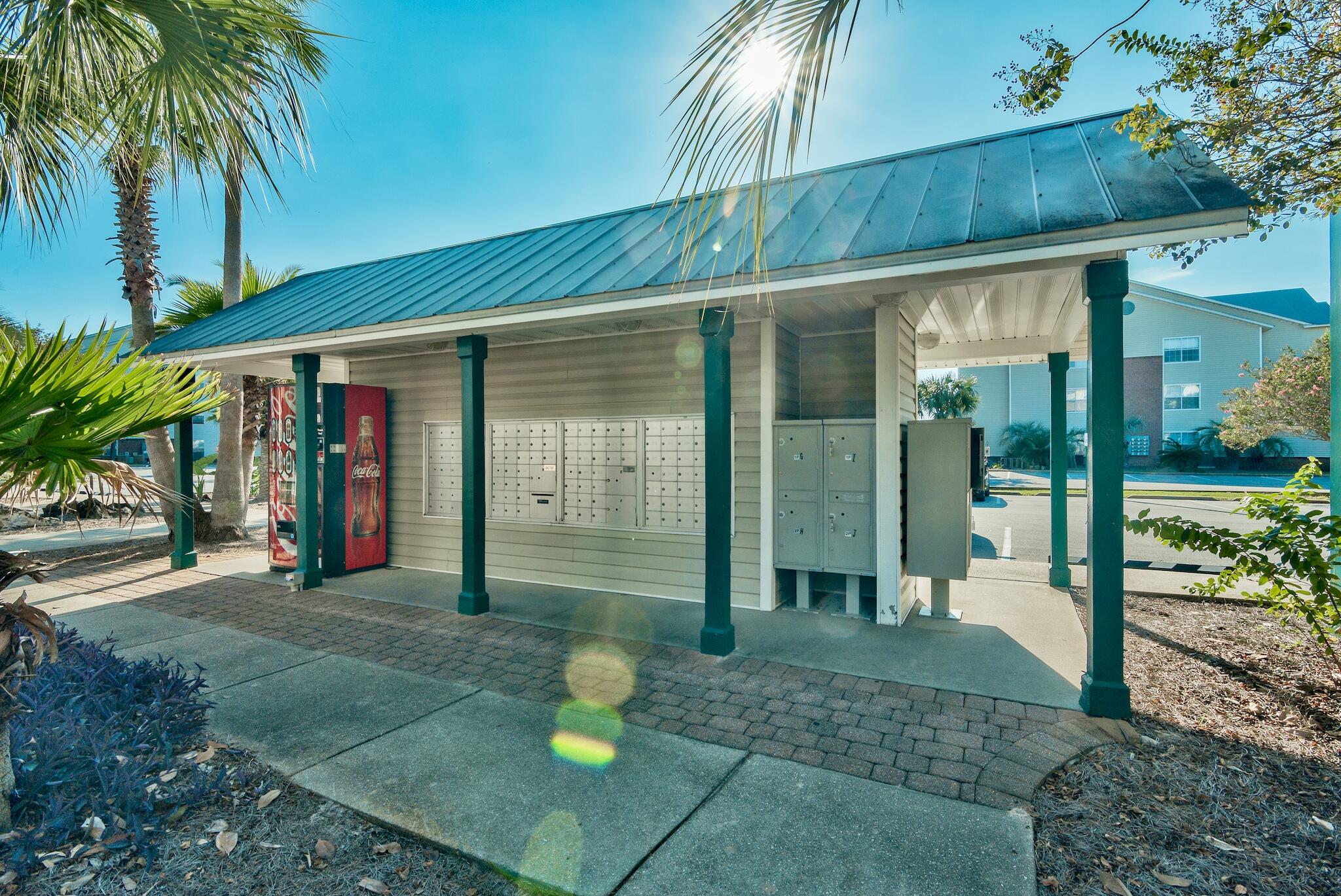 4070 Dancing Cloud Court, Unit 187 Destin, FL 32541 - Photo 10 of 20 a view of a house with a backyard and porch