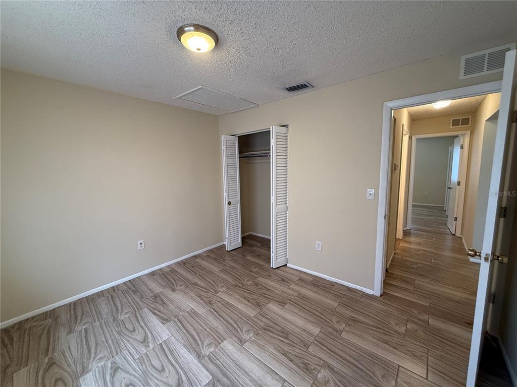 2744 Botts Landing Road, Unit 603 DeLand, FL 32720 - Photo 11 of 17 a view of empty room with wooden floor