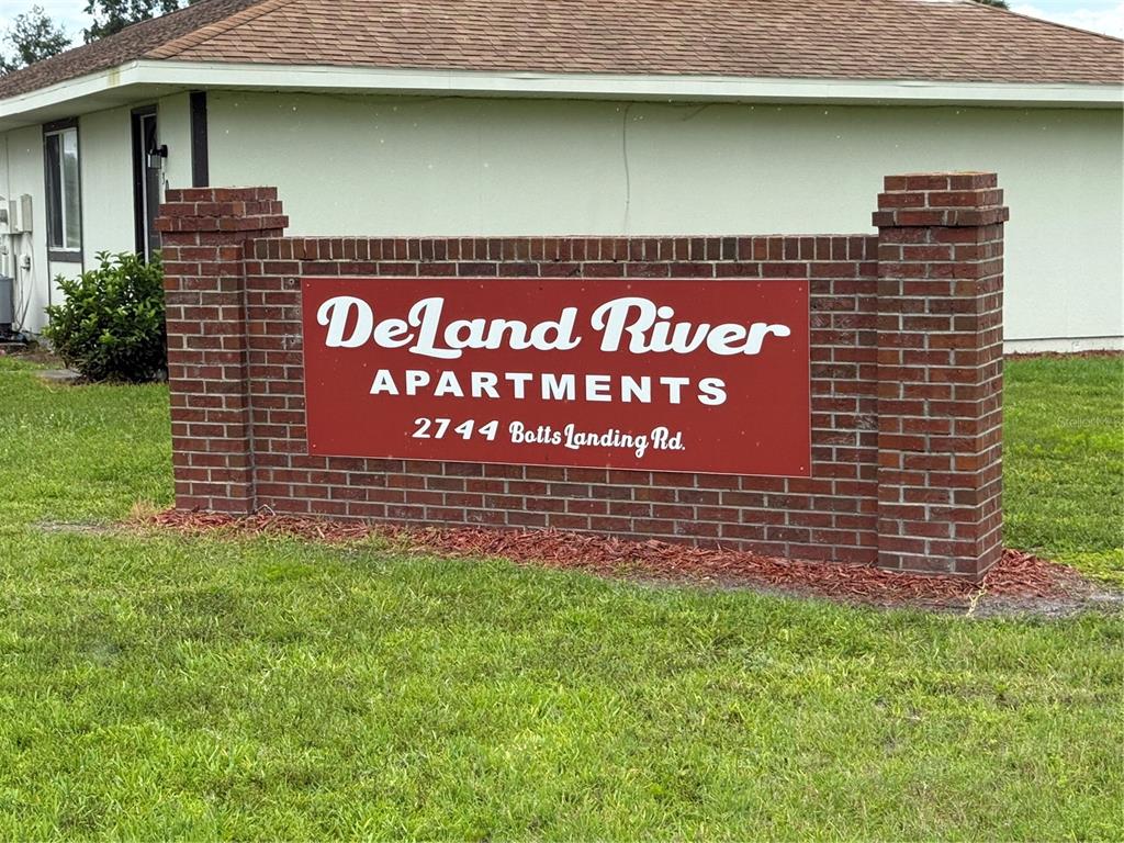 2744 Botts Landing Road, Unit 603 DeLand, FL 32720 - Photo 17 of 17 a sign on the side of a building