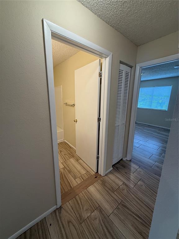 2744 Botts Landing Road, Unit 603 DeLand, FL 32720 - Photo 5 of 17 a view of a hallway with wooden floor and a hallway