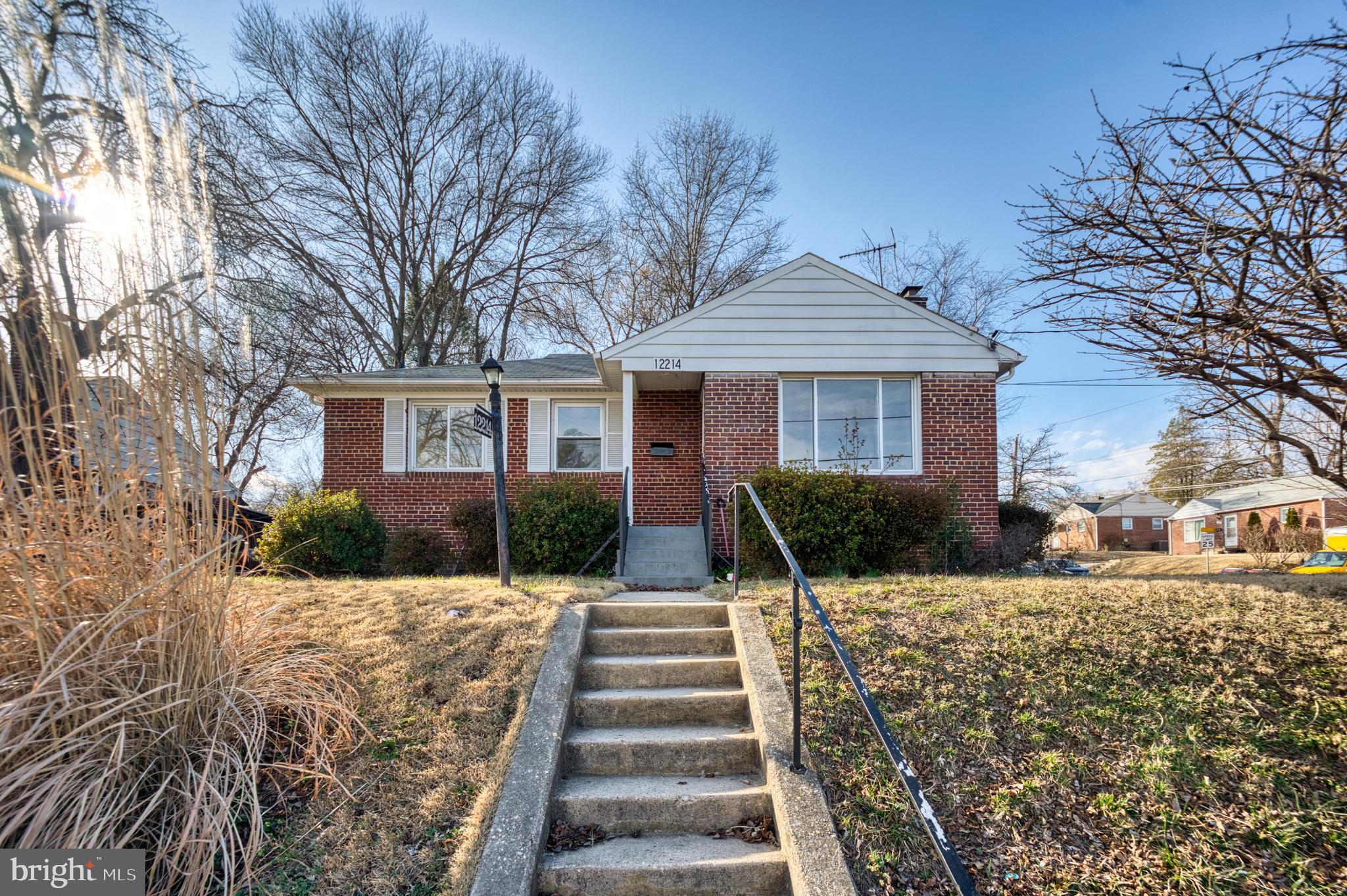 12214 Connecticut Avenue Silver Spring, MD 20902 - Photo 1 of 18 a front view of a house with a yard