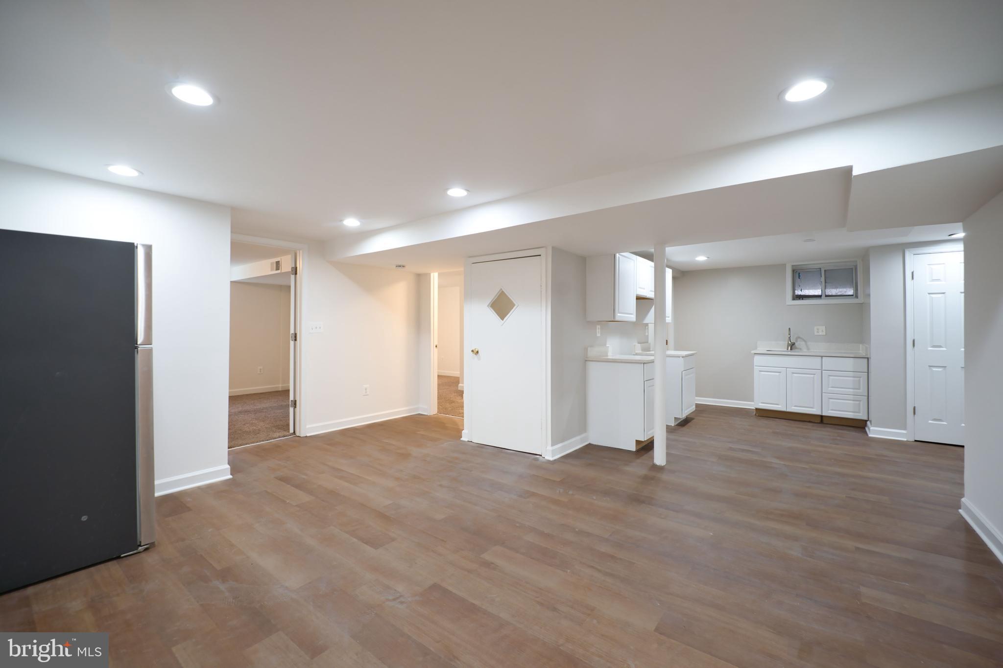12214 Connecticut Avenue Silver Spring, MD 20902 - Photo 15 of 18 a view of a big room with wooden cabinet and windows