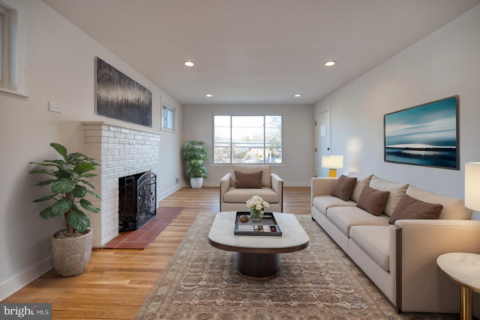 12214 Connecticut Avenue Silver Spring, MD 20902 - Photo 2 of 18 a living room with furniture a fireplace and a potted plant