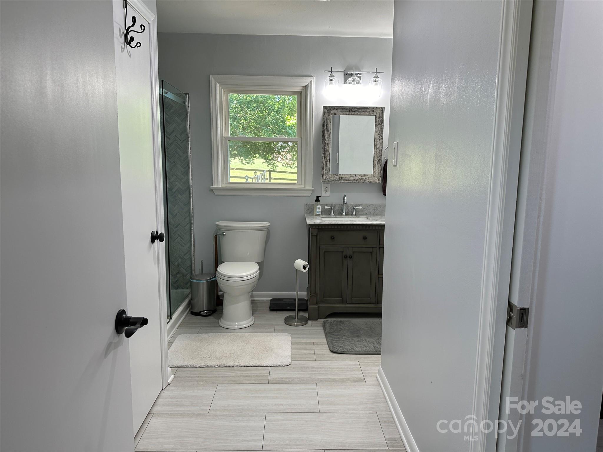 1118 Stack Road Monroe, NC 28112 - Photo 19 of 42 a bathroom with a toilet sink and mirror