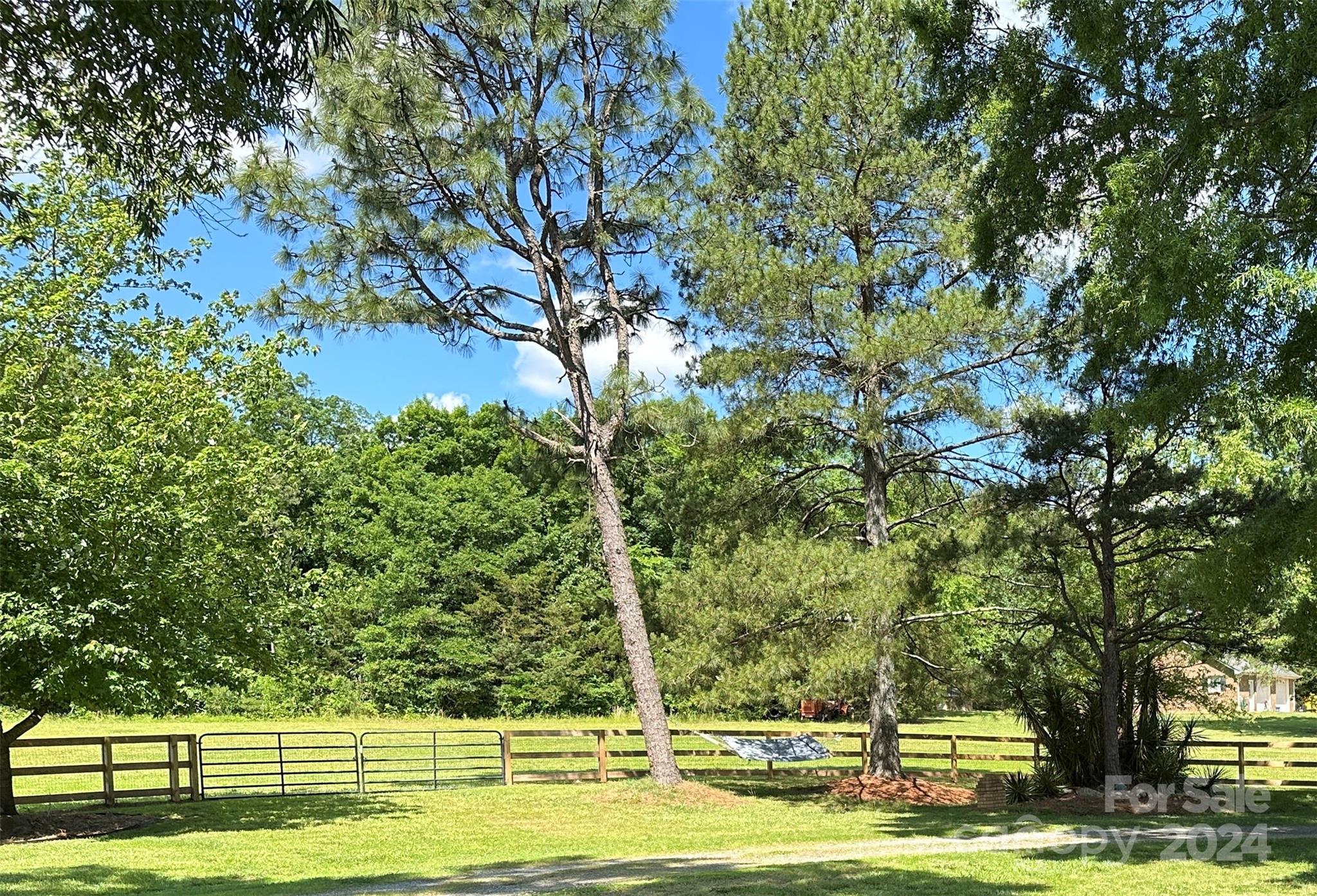 1118 Stack Road Monroe, NC 28112 - Photo 32 of 42 a view of swimming pool with yard and trees in the background