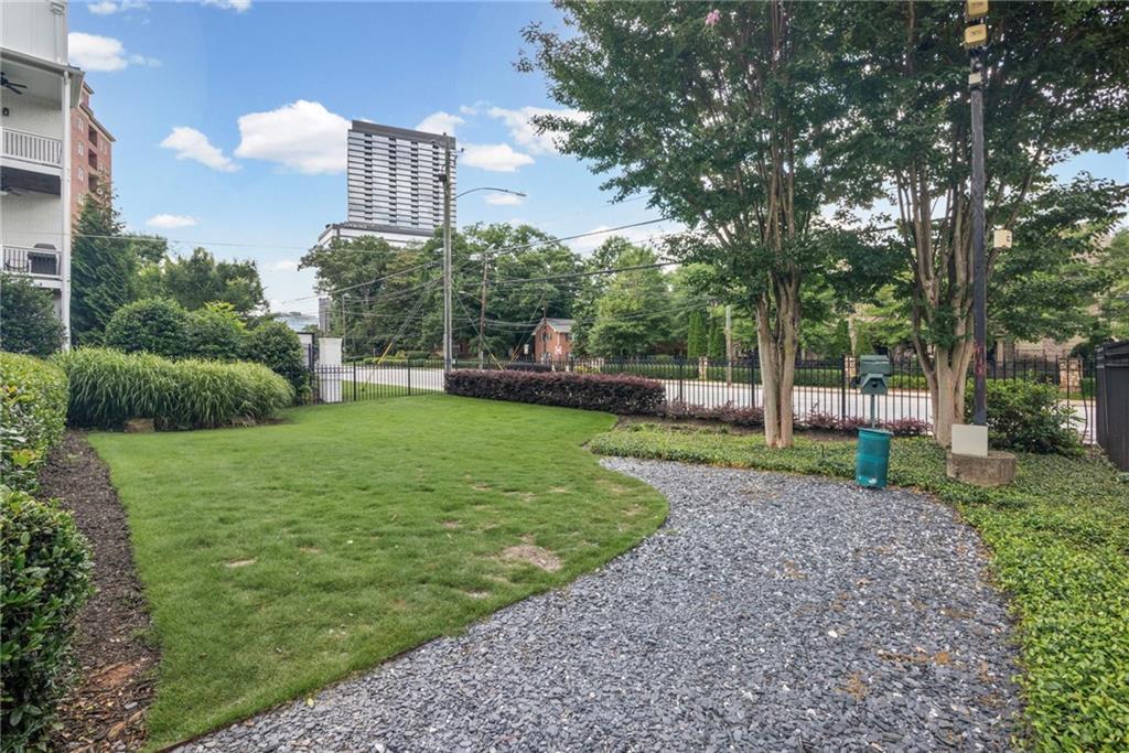 3675 Peachtree Road Northeast, Unit 45 Atlanta, GA 30319 - Photo 5 of 42 a view of a house with a yard and a trees