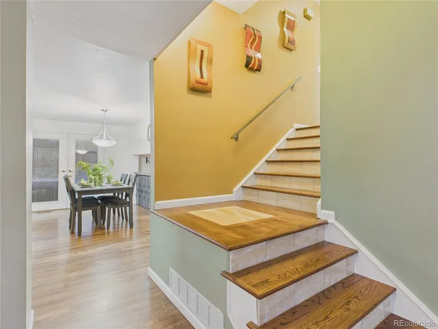 a spacious bedroom with a bed and cabinet