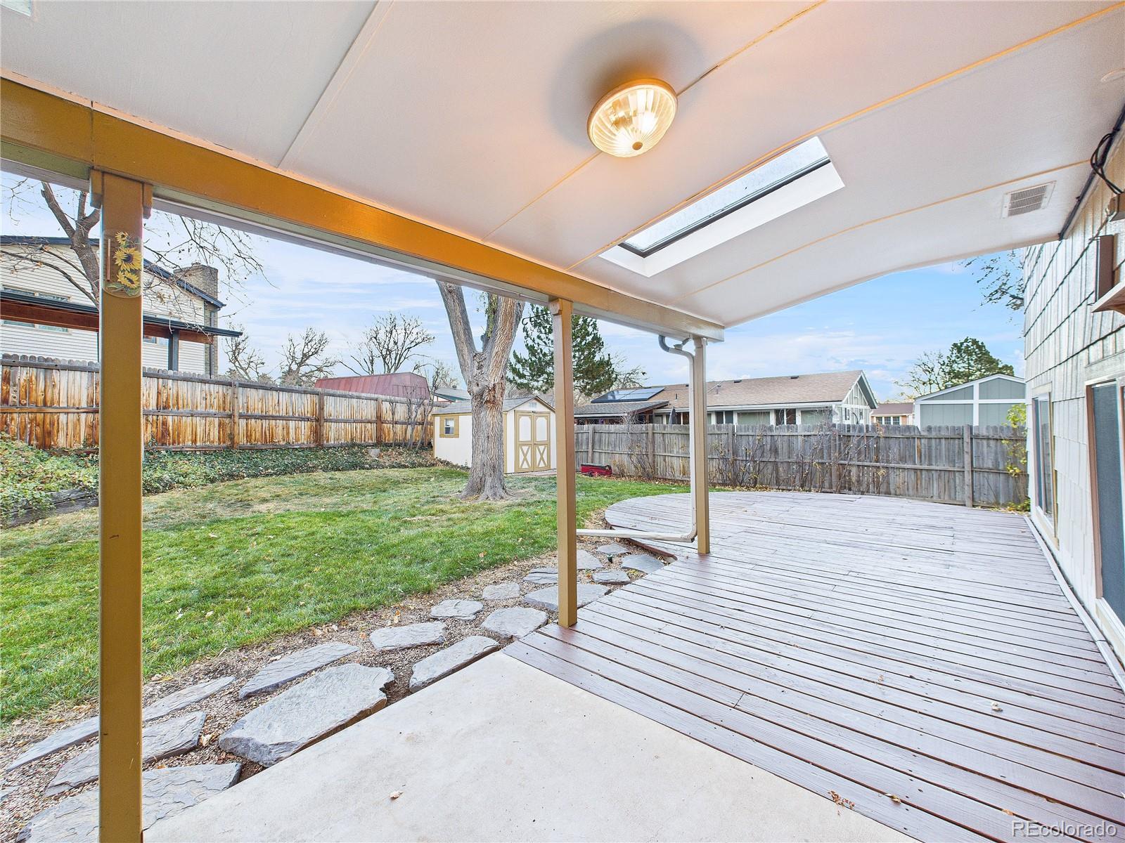 8373 Zephyr Street Arvada, CO 80005 - Photo 4 of 31 a view of a porch with a backyard
