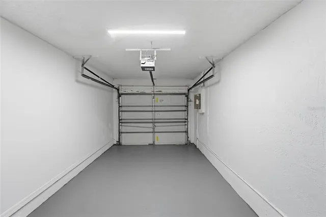 a view of room that has stairs and a chandelier