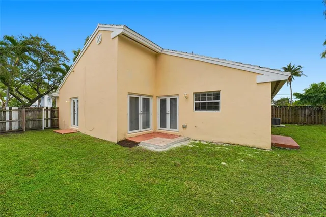 a backyard of a house with lots of green space