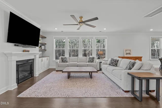 a bathroom with a double vanity sink a shower and a mirror