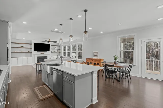 an aerial view of a house with a lake view