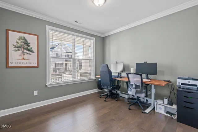 a view of a dining room with furniture wooden floor and chandelier