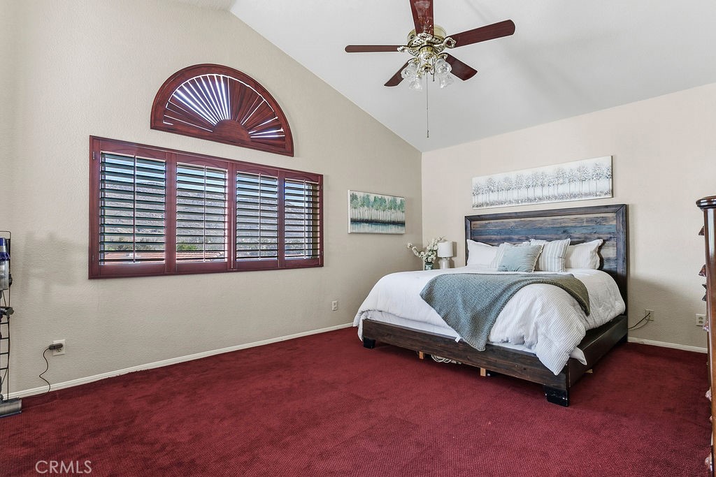 22720 Springmist Drive Moreno Valley, CA 92557 - Photo 13 of 40 a bedroom with a bed dresser and a window