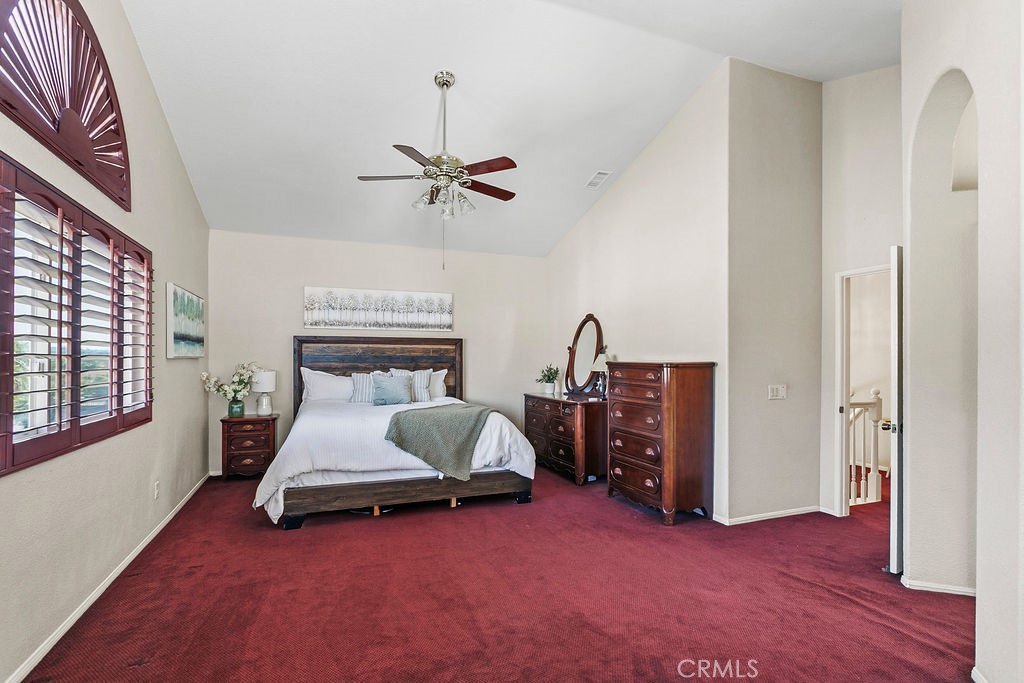 22720 Springmist Drive Moreno Valley, CA 92557 - Photo 15 of 40 a living room with furniture and a ceiling fan