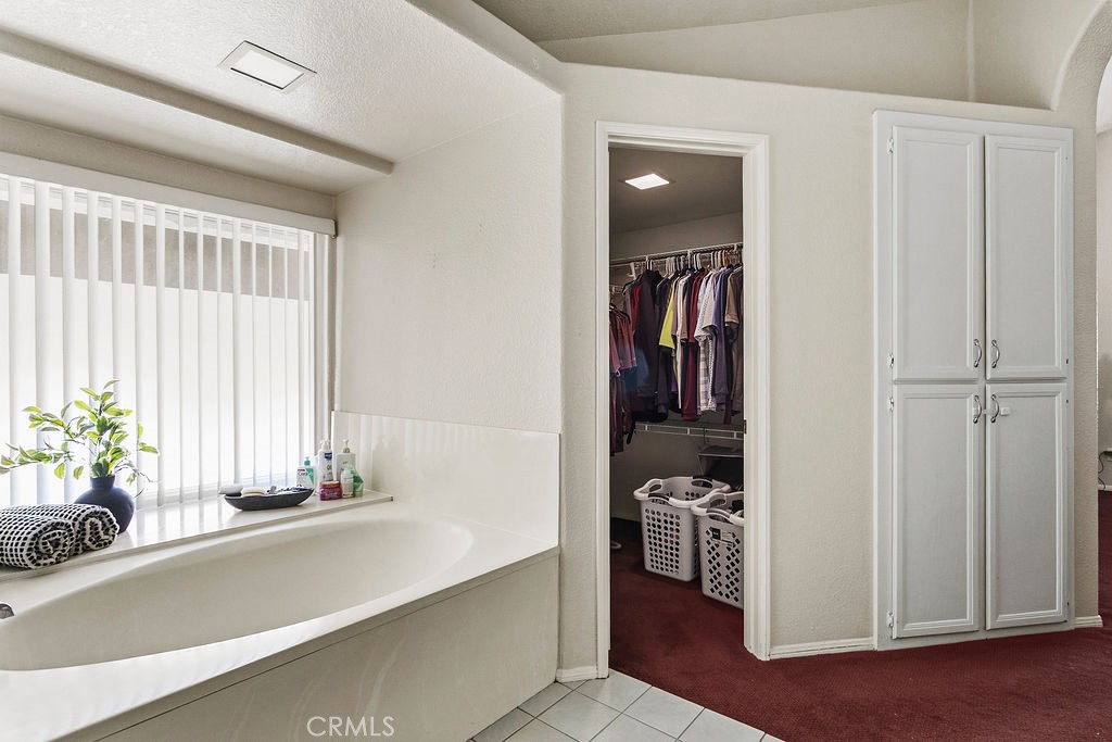 22720 Springmist Drive Moreno Valley, CA 92557 - Photo 17 of 40 a view of a living room and bathroom