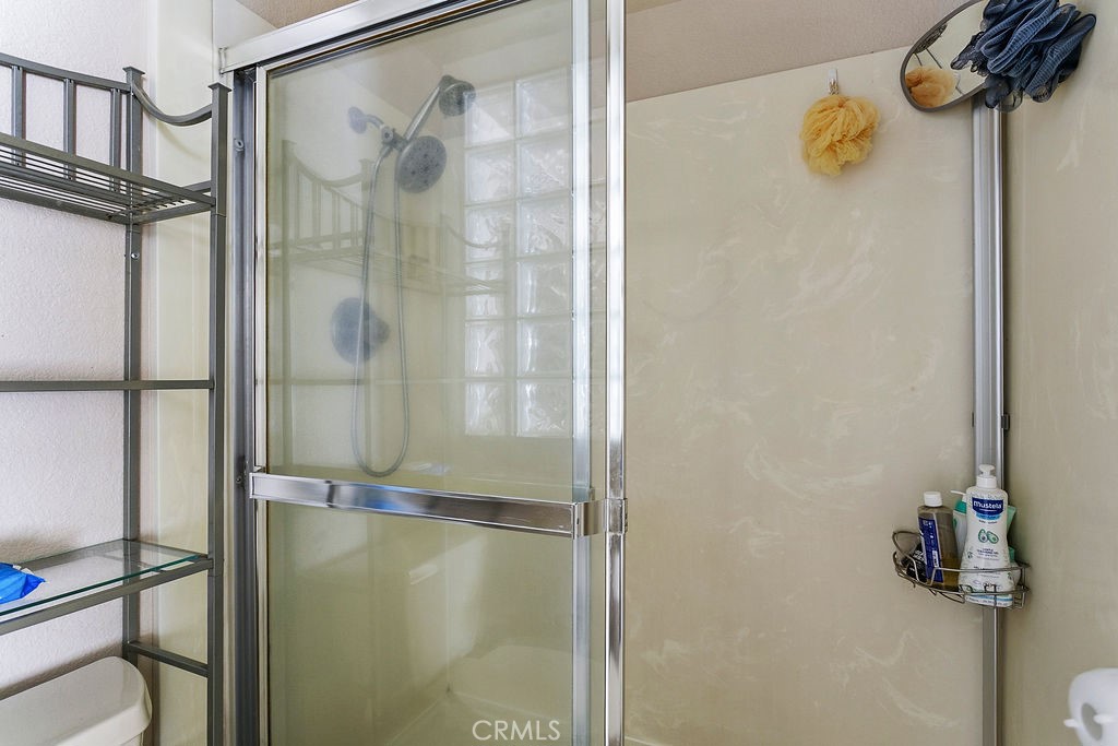22720 Springmist Drive Moreno Valley, CA 92557 - Photo 18 of 40 a bathroom with a shower
