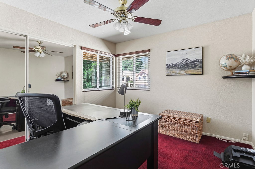 22720 Springmist Drive Moreno Valley, CA 92557 - Photo 22 of 40 a view of a workspace with furniture and a window