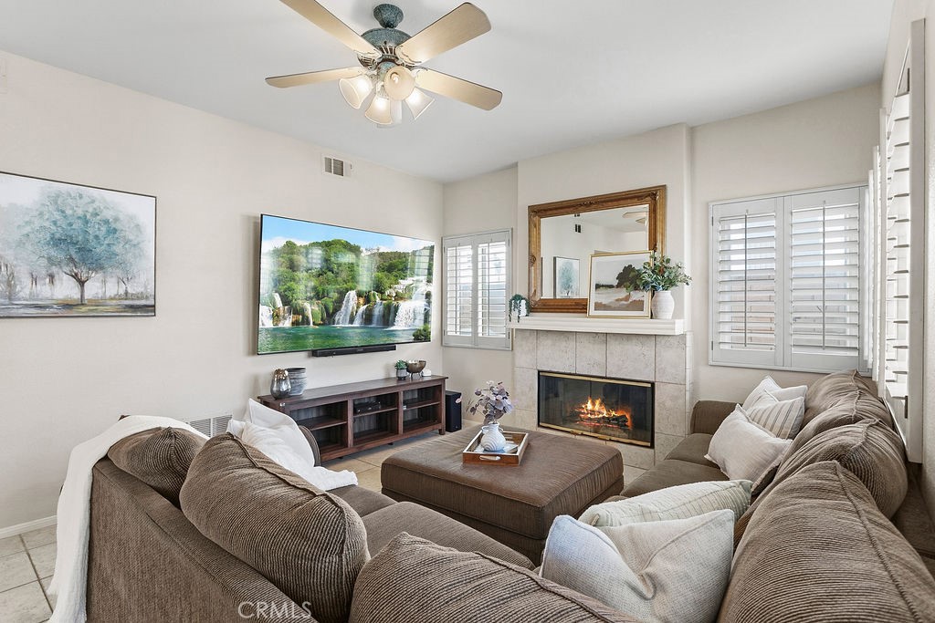 22720 Springmist Drive Moreno Valley, CA 92557 - Photo 3 of 40 a living room with furniture fireplace and window