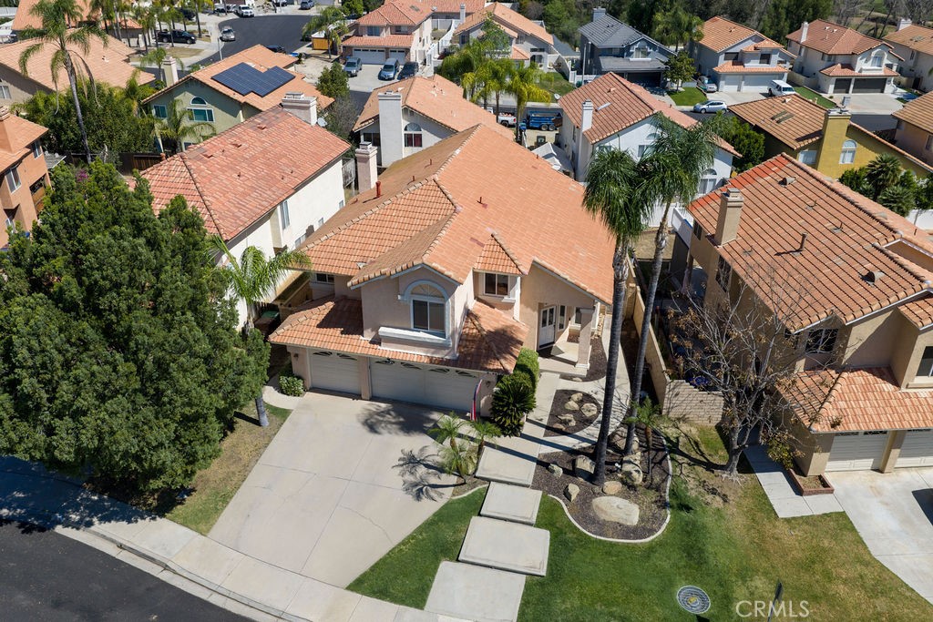 22720 Springmist Drive Moreno Valley, CA 92557 - Photo 33 of 40 an aerial view of a house with garden space and street view
