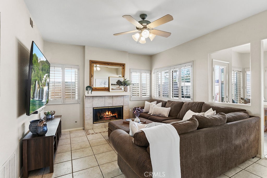 22720 Springmist Drive Moreno Valley, CA 92557 - Photo 4 of 40 a living room with furniture and a fireplace
