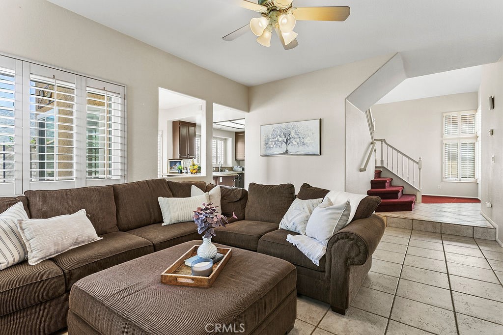 22720 Springmist Drive Moreno Valley, CA 92557 - Photo 5 of 40 a living room with furniture and a large window