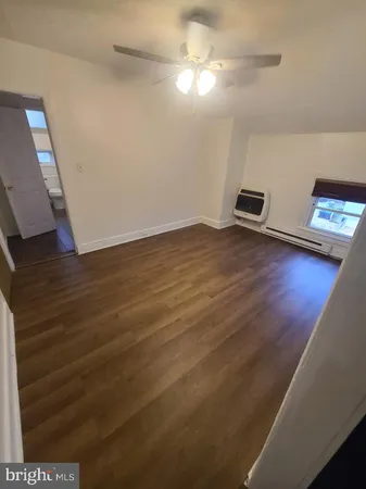 a view of a livingroom with furniture nad wooden floor