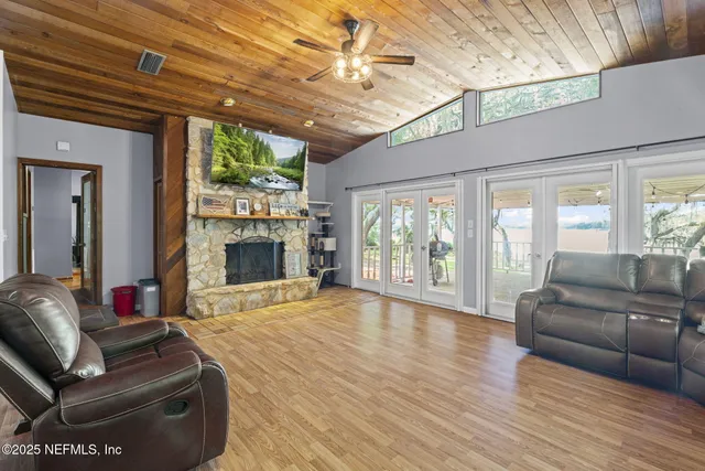 a view of a house with a yard balcony and slide