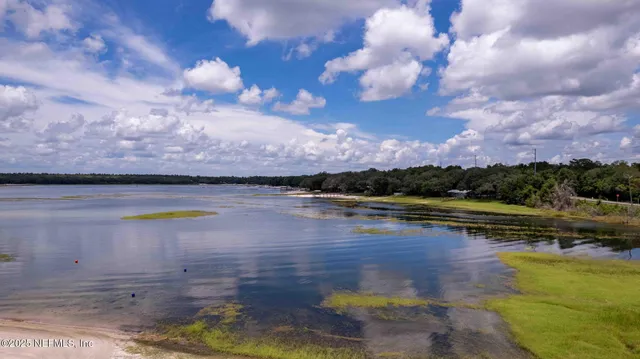 a kitchen with stainless steel appliances granite countertop a sink and a refrigerator