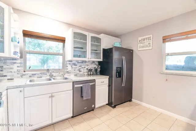 a bedroom with a bed and a book shelf