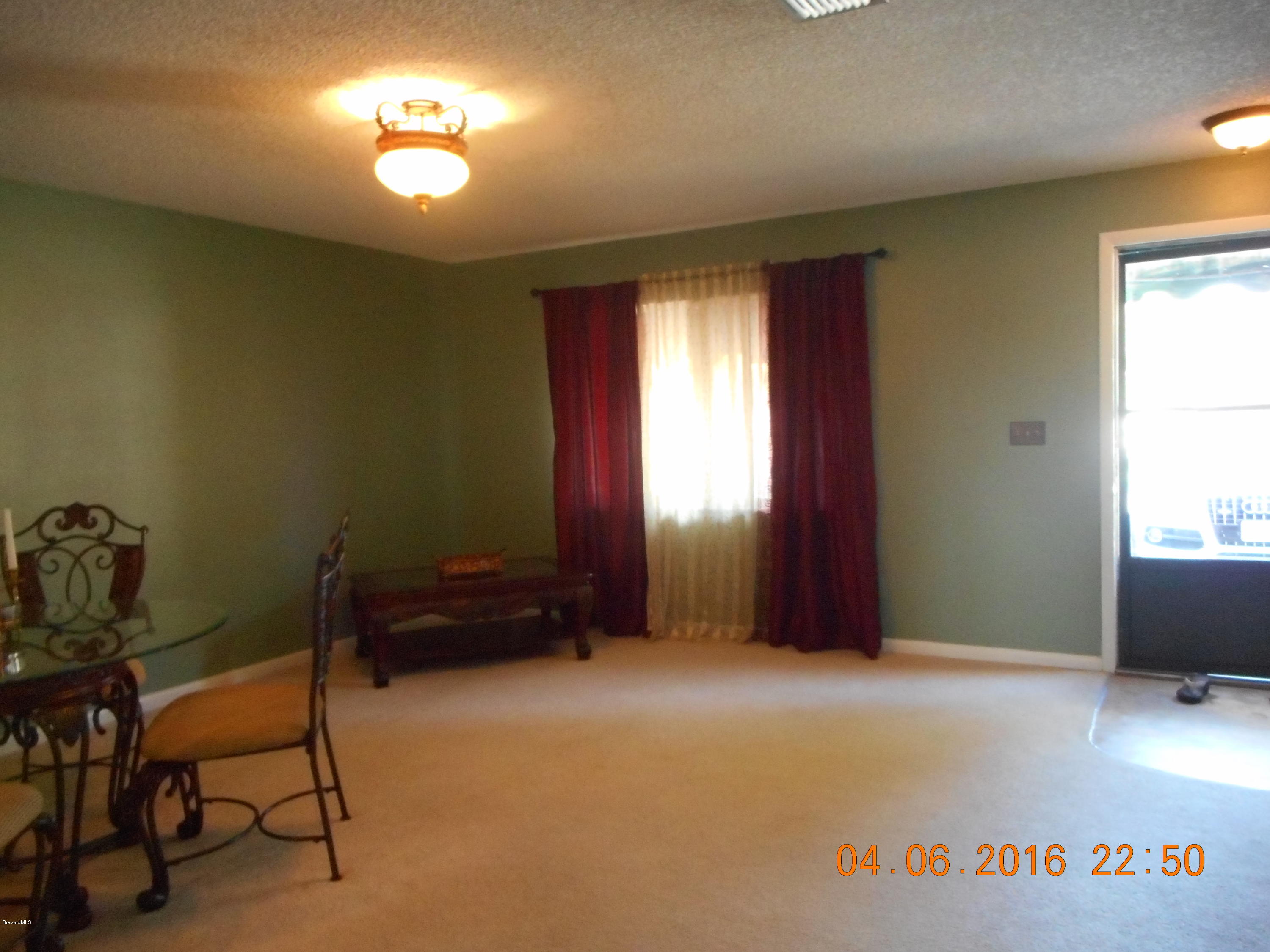 1882 Murrell Road, Unit K41 Rockledge, FL 32955 - Photo 5 of 27 Living Room 2
