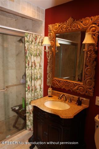 115 Desota Road West Palm Beach, FL 33405 - Photo 5 of 8 a bathroom with a sink and a mirror
