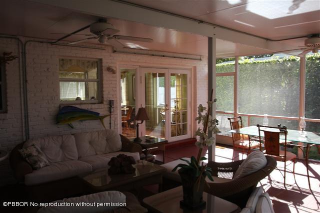 115 Desota Road West Palm Beach, FL 33405 - Photo 7 of 8 a living room with furniture and a large window