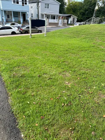 a view of a house with a backyard porch and sitting area
