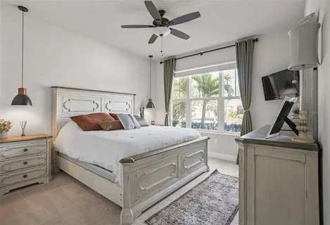 a bed room with a bed and a window
