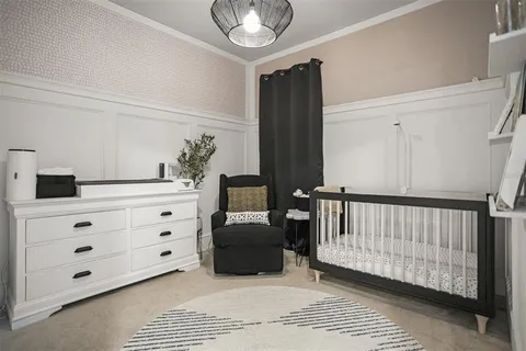 a bedroom with furniture and a window