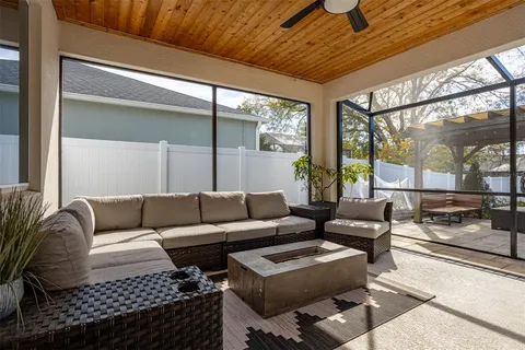 a view of balcony with a dining table and chairs