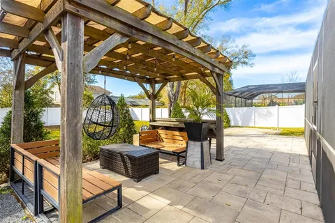 a view of a chairs and table in the patio