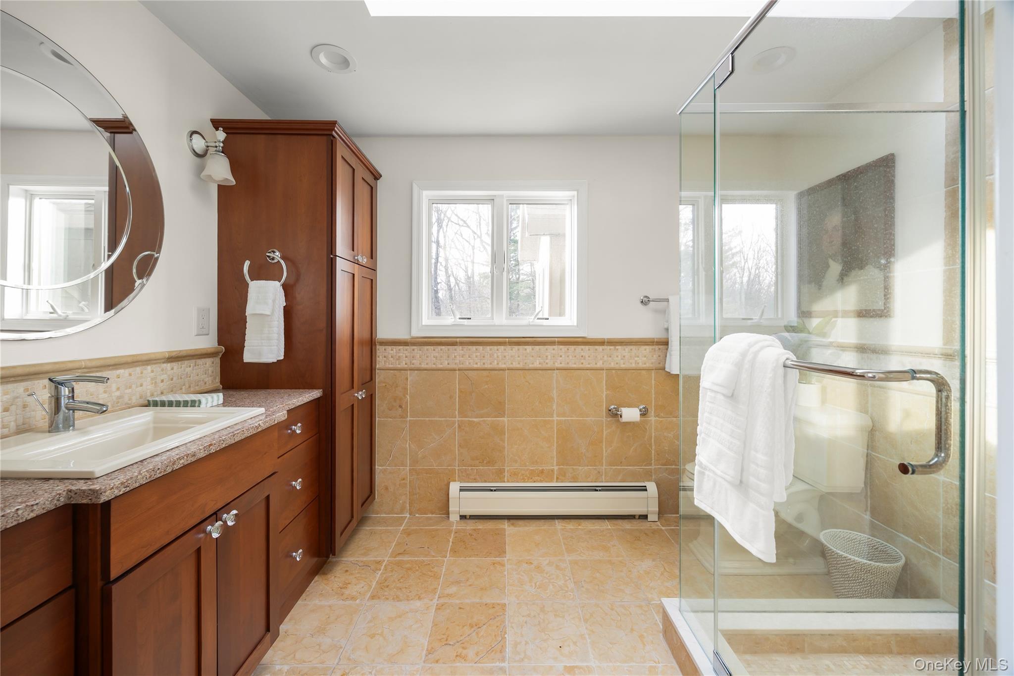 3 Lisa Court Red Hook, NY 12571 - Photo 14 of 15 a bathroom with a granite countertop sink a mirror and a shower