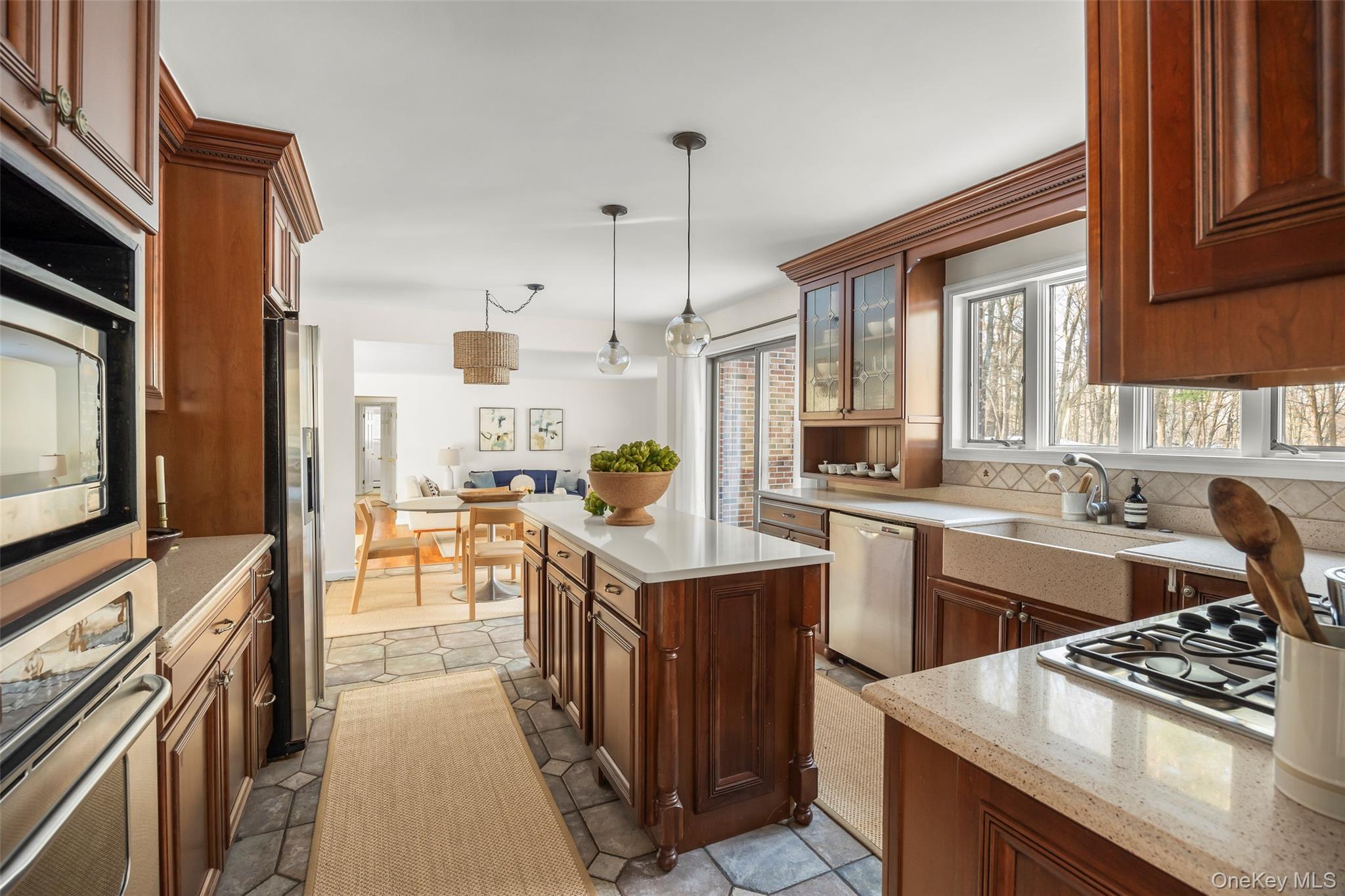 3 Lisa Court Red Hook, NY 12571 - Photo 5 of 15 a kitchen with stainless steel appliances kitchen island granite countertop a stove a sink dishwasher and a microwave oven with white cabinets