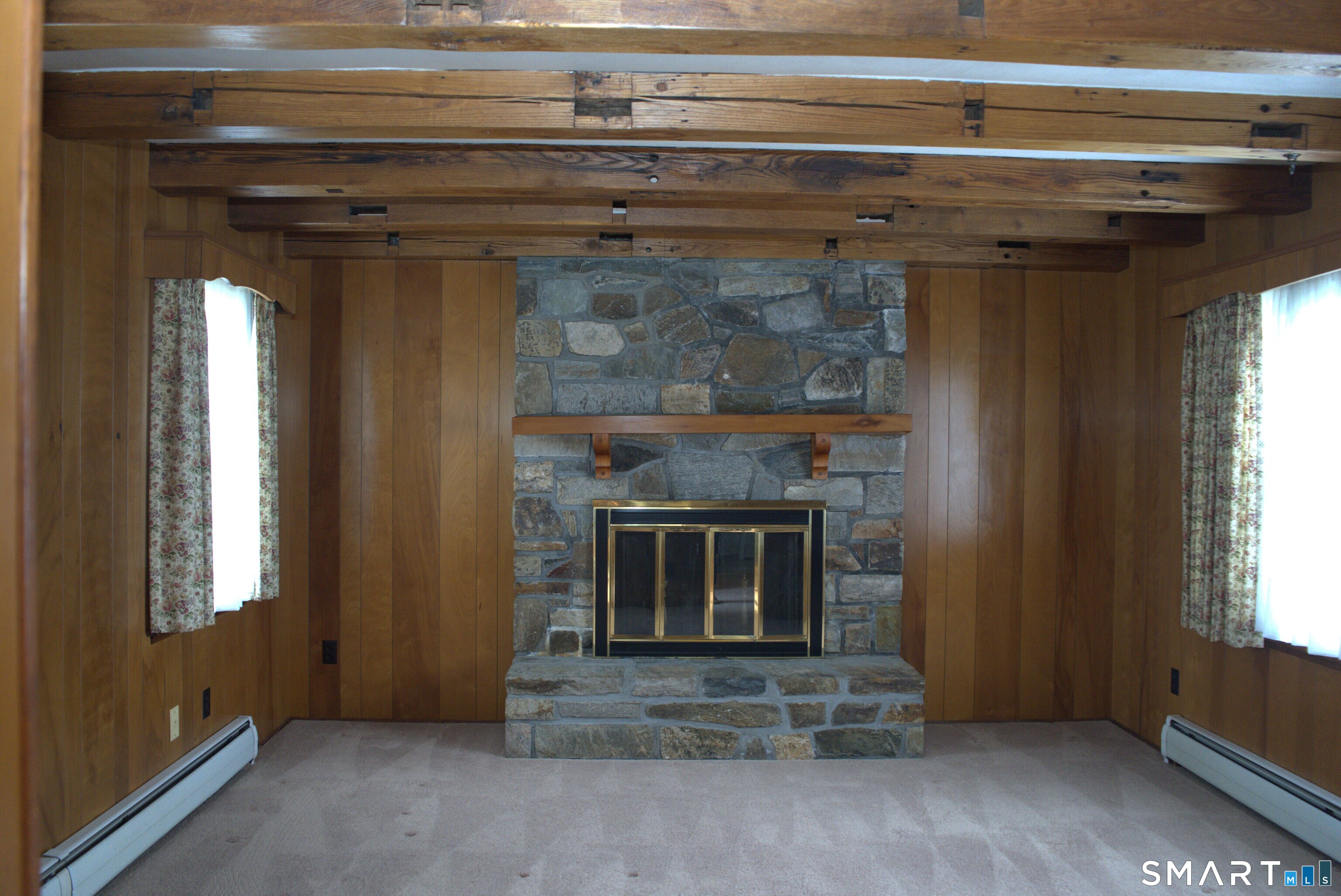 293 Kick Hill Road Lebanon, CT 06249 - Photo 11 of 21 Exquisite field stone hearth and chesnut beams.