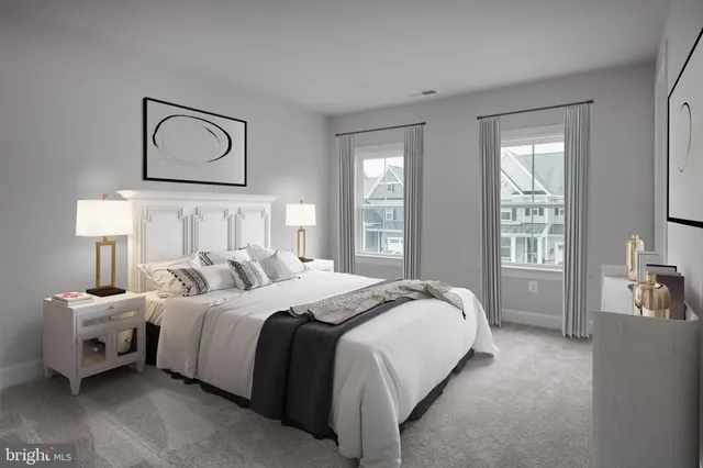 a bedroom with a bed and a lamp