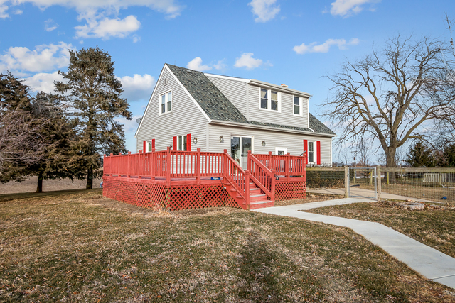 49W435 Plank Road Sycamore, IL 60178 - Photo 22 of 31 a front view of a house with a yard