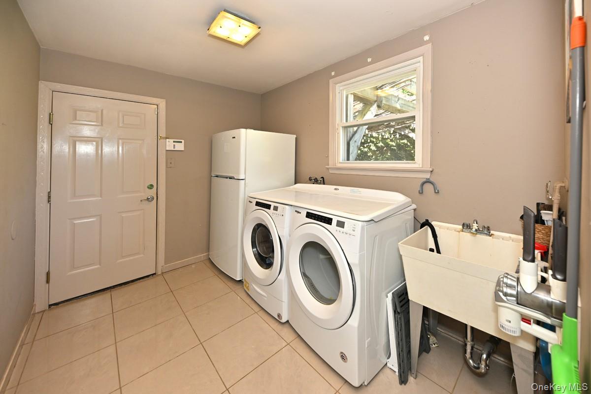 11 Deerwood Road Spring Valley, NY 10977 - Photo 21 of 34 a utility room with dryer and washer