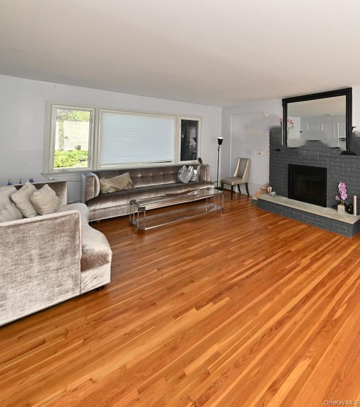 11 Deerwood Road Spring Valley, NY 10977 - Photo 22 of 34 a living room with furniture and a fireplace