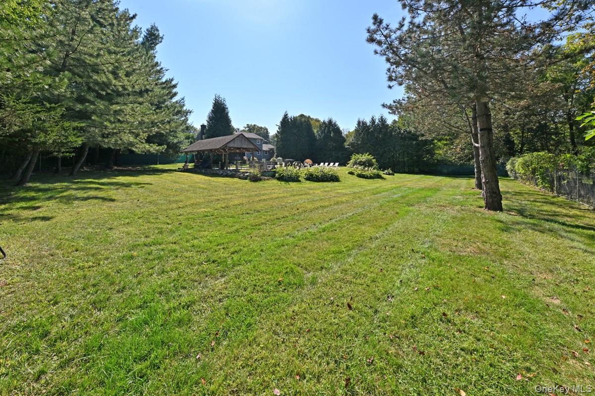 11 Deerwood Road Spring Valley, NY 10977 - Photo 32 of 34 a backyard of a house with table and chairs