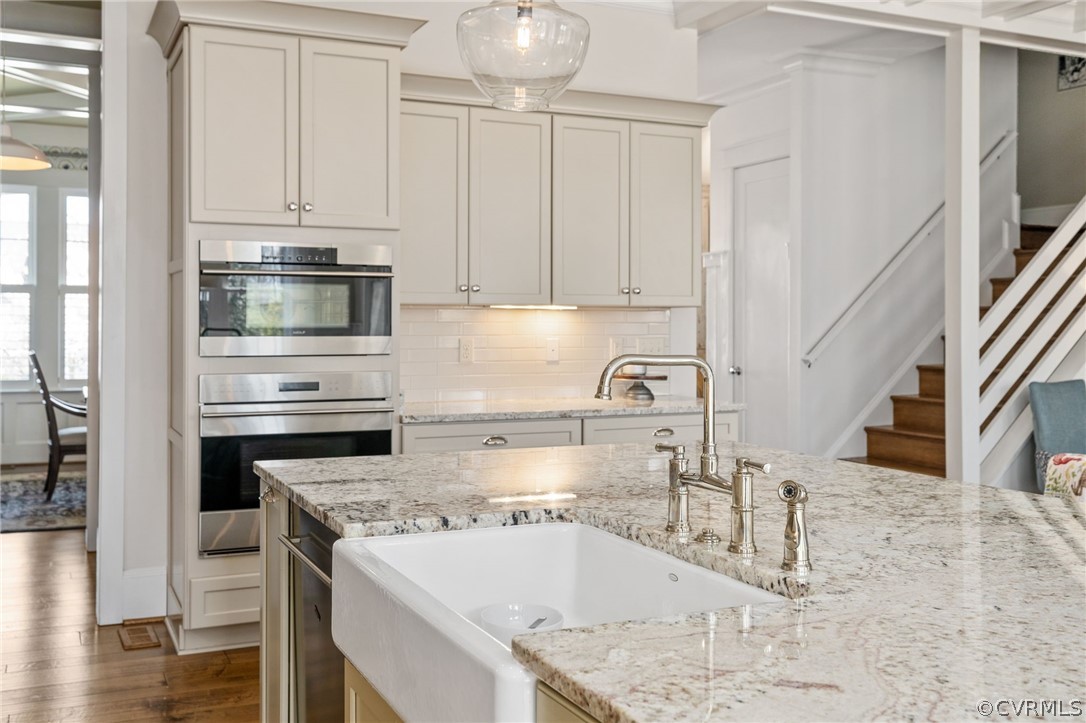 3412 Barkham Drive Midlothian, VA 23112 - Photo 19 of 50 a kitchen with stainless steel appliances granite countertop a sink stove and cabinets