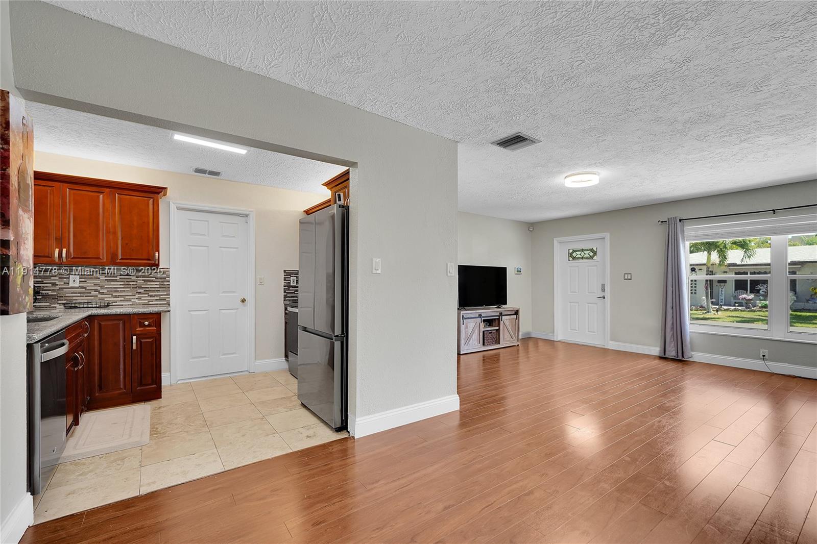 6001 Northwest 66th Terrace Tamarac, FL 33321 - Photo 8 of 30 a view of a kitchen with a sink and a stove top oven