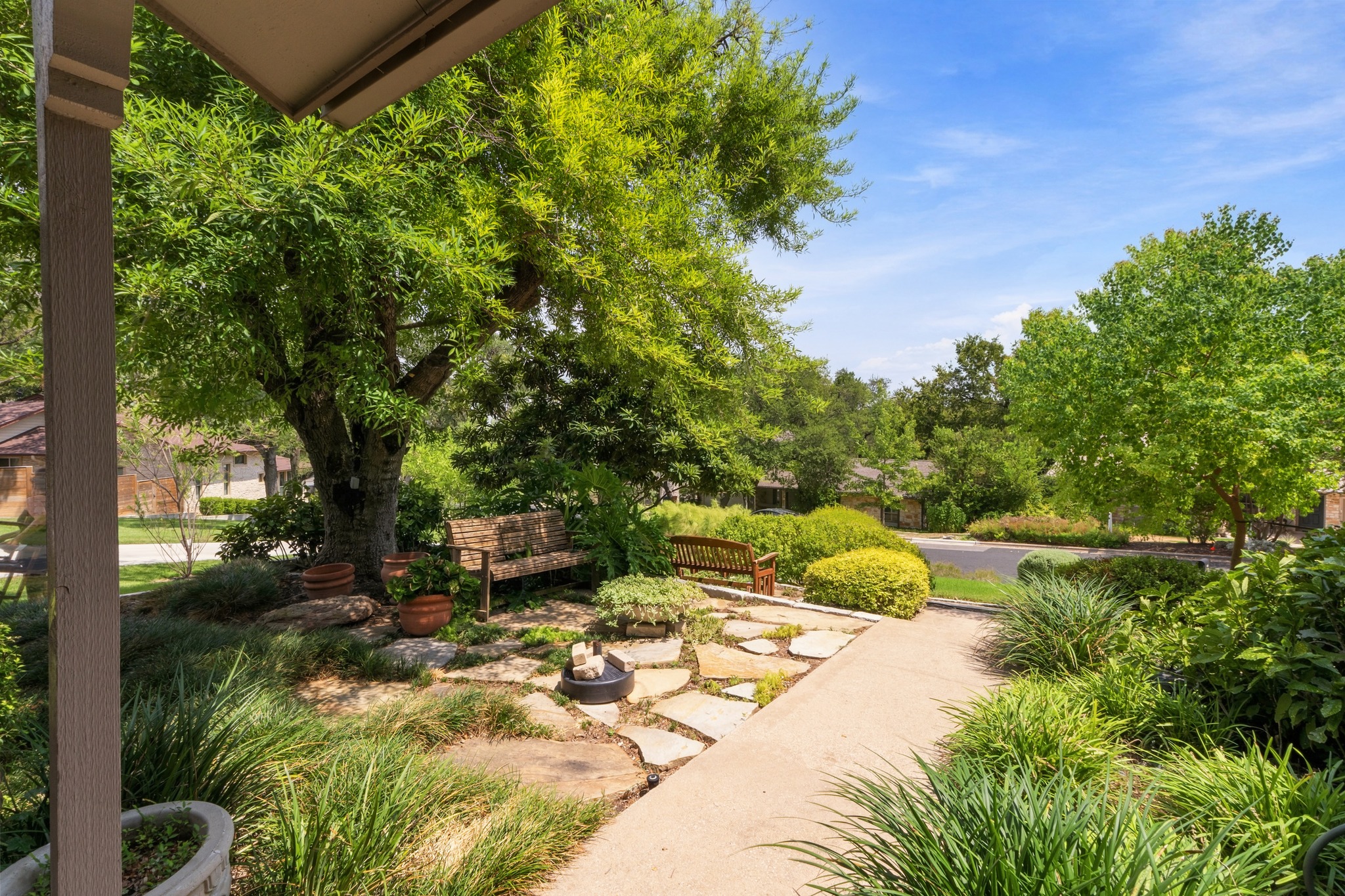 1904 Stoneridge Road Austin, TX 78746 - Photo 35 of 40 Thoughtfully designed garden paths and mature plantings add character throughout the outdoor spaces.