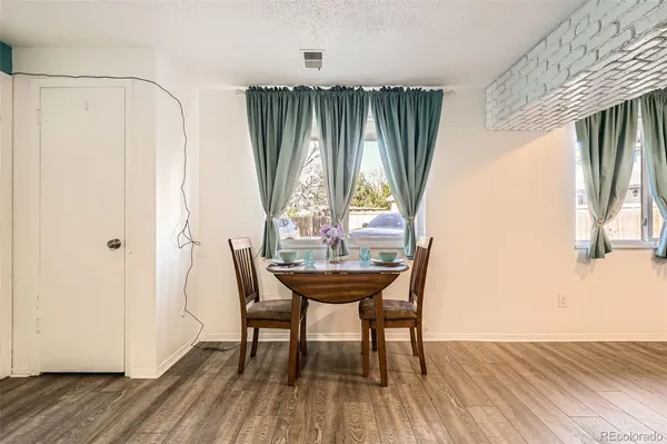 a view of a room with furniture and window